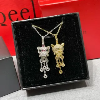 Collier argent et or avec pendentifs tête d'animal et pierres pavé-set