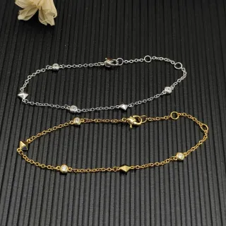 Pulsera de plata y oro con cadena de eslabones finos engastada en bezel con piedras
