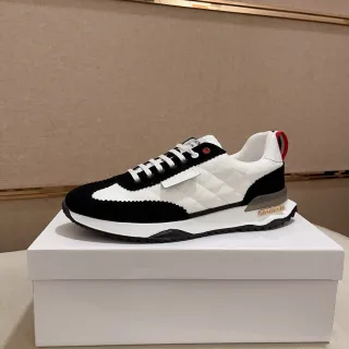 Zapatillas blancas negras de cuero acolchado con paneles de ante