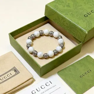 Gucci سوار خرز رخامي و G متشابك