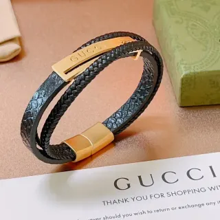 Gucci سوار جلد مضفر أسود وذهبي مزدوج اللف