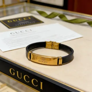 Gucci سوار جلد أسود وذهبي النبرة بلون لوحة