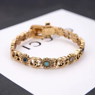 Gucci سوار ذهبي أزرق معدني interlocking GG روابط