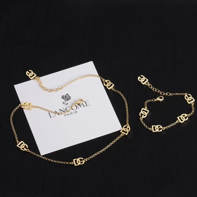 Lancôme Gold Chain Interlocking Logo Charms Bracelet 9