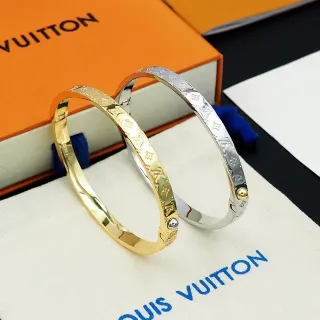 Louis Vuitton Brazalete Hinged de Oro y Plata con Monograma Grabado