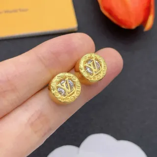 Louis Vuitton Brincos dourados transparentes em forma de moeda com monograma