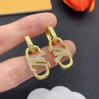 Louis Vuitton Lockme بافيه كريستال أقراط ذهبي