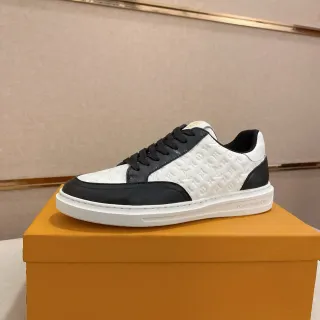 Louis Vuitton LV Trainer Blanco Negro Cuero Monograma Embossado Construcción Panel Dos Tonos Sneakers Lifestyle