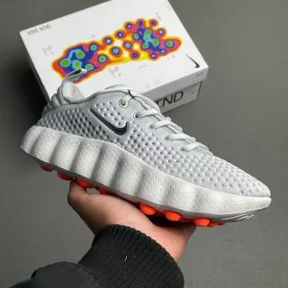 Nike رمادي برتقالي الجزء العلوي التنسج المثقوب متشكل حواف بارزة وسط حذاء أسلوب حياة