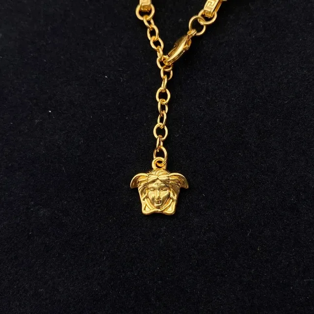 سوار Versace ذهبي أسود معدني مينا رؤوس ميدوزا 6