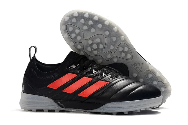 Adidas أحذية كرة القدم Turf بالأسود والبرتقالي مع upper من النسج والصناعي 3 شرائط 5