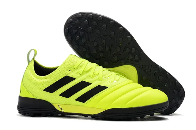 Adidas أحذية كرة القدم Turf بالأسود والبرتقالي مع upper من النسج والصناعي 3 شرائط 7