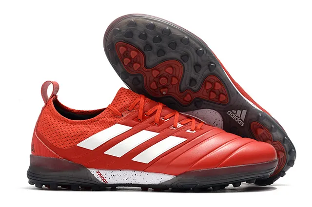 Adidas أحذية كرة القدم Turf بالأسود والبرتقالي مع upper من النسج والصناعي 3 شرائط 10