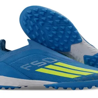 Adidas أزرق أصفر كولار فائق الملاءمة للجوارب وجه علوي مصنوع من مواد اصطناعية ذات ملمس عشب اصطناعي أحذية كرة القدم