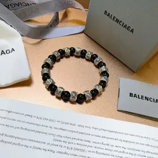 Balenciaga Bracelet perlé noir et argenté
