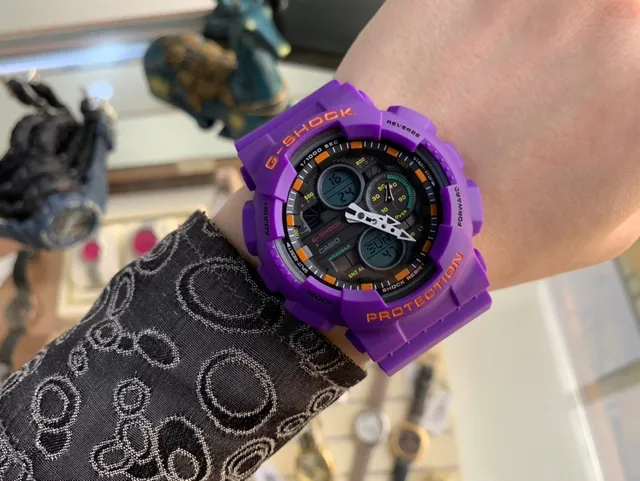 Casio G-Shock GA-100 أرجواني وبرتقالي ساعة رياضية 2