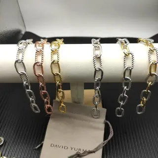 David Yurman Cable Classics سوار فضي ذهبي روابط ملتوية بيضاوية ناعمة