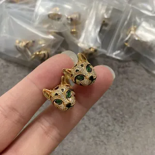 Aretes de cabeza felina verde dorada ojos
