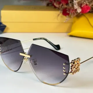 Lunettes de soleil gris doré sans cadre avec coupe géométrique lentilles dégradées