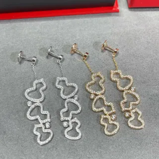 Brincos pendentes com motivo de coração em filigrana e pavê