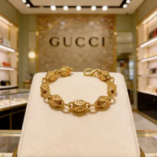 Gucci Pulsera dorada con eslabones geométricos facetados interconectados motivo GG