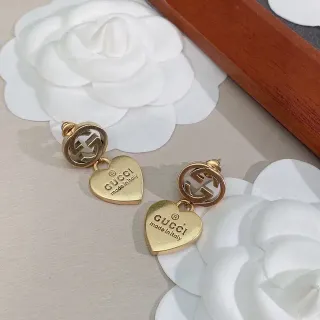 Gucci أقراط Interlocking G تيارم قلب ذهبي اللون