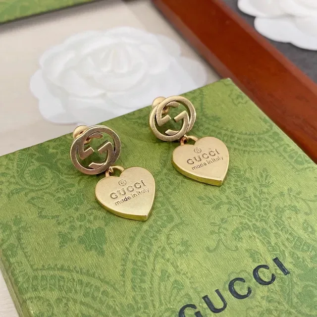 Gucci أقراط Interlocking G تيارم قلب ذهبي اللون 6