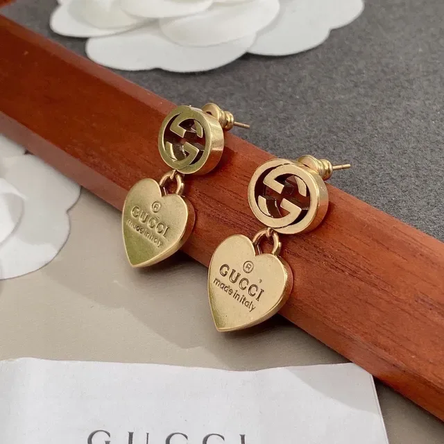 Gucci أقراط Interlocking G تيارم قلب ذهبي اللون 7