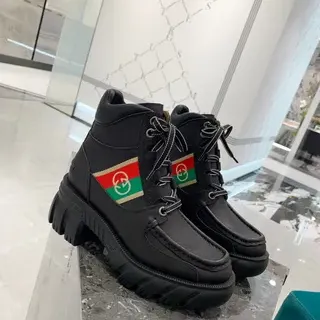 Gucci Rhyton काला चमड़ा जाला पट्टी एंकील बूट्स