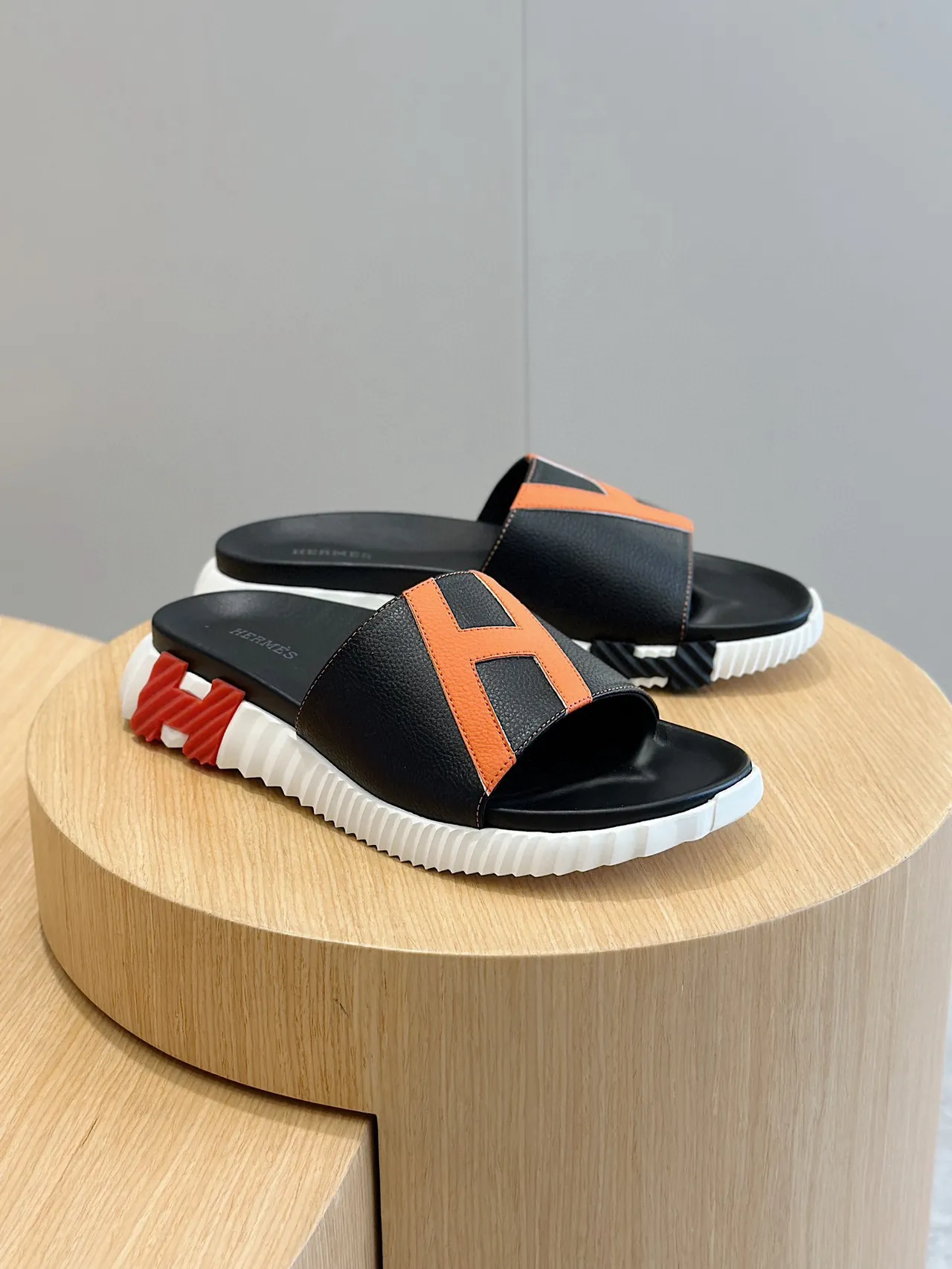 Hermès Oran Slide Black and Orange Leather Slippers 3
