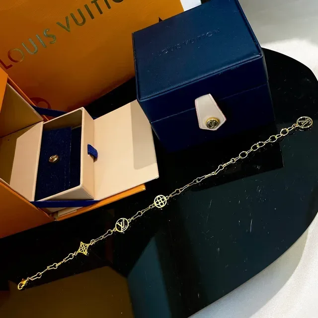 Louis Vuitton Gold-Tone LV Monogram Charm Link Bracelet 8