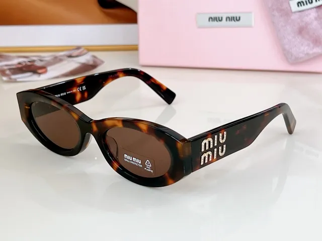 Miu Miu 粉色猫眼椭圆形太阳镜 6
