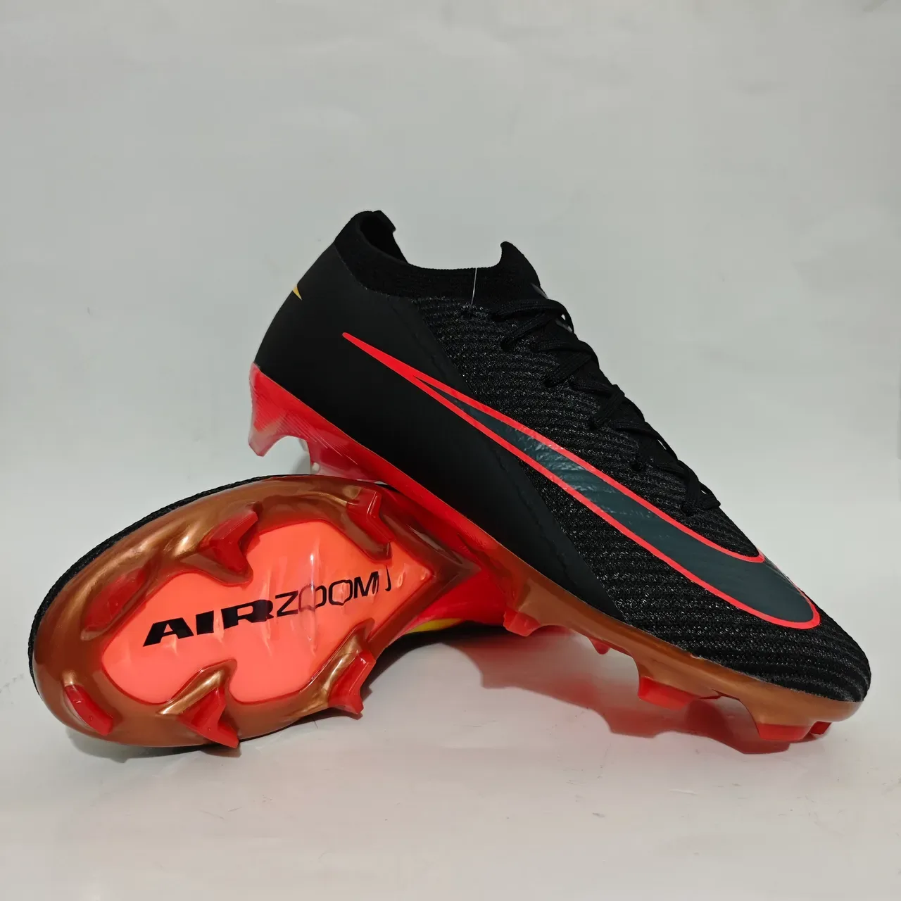 Nike Chaussures de football noir rouge Flyknit, tige basse, pour terrain ferme 11