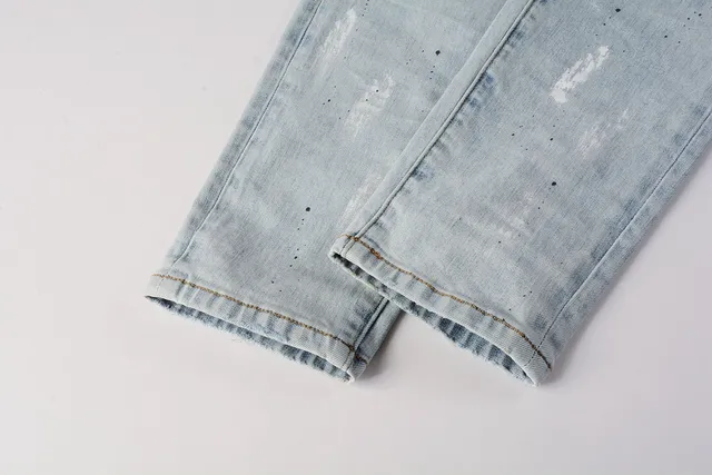 Jeans slim-fit distressed com salpicância de tinta da marca Purple Brand 3