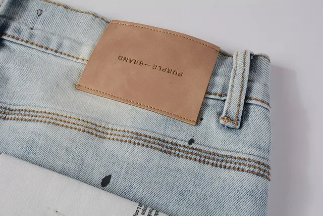 Jeans slim-fit distressed com salpicância de tinta da marca Purple Brand 4
