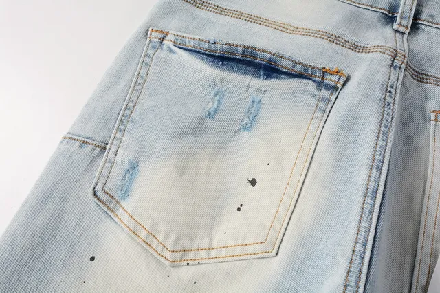 Jeans slim-fit distressed com salpicância de tinta da marca Purple Brand 5