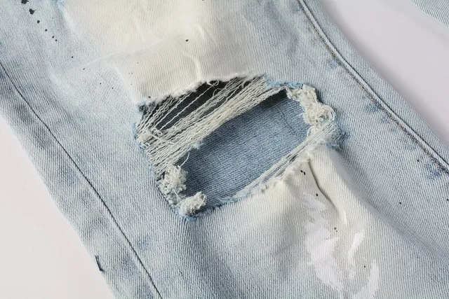 Jeans slim-fit distressed com salpicância de tinta da marca Purple Brand 7