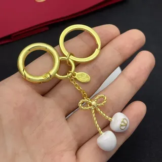 Valentino चेरी বো সোনালি সাদা ধাতব সিরামিক চেরি ব্রেসলেট