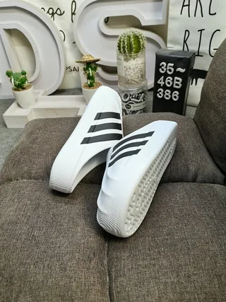 Adidas Adifom Stan Mule blancas y negras con tres rayas mulas 7
