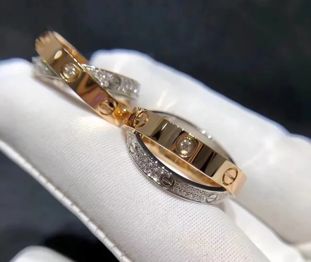 Anéis Cartier Love de dupla banda com motivo de parafuso pavimentados com diamantes em ouro de duas cores 2