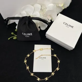 Celine Triomphe سوارة ذهبية اللون مع شعار الرابط