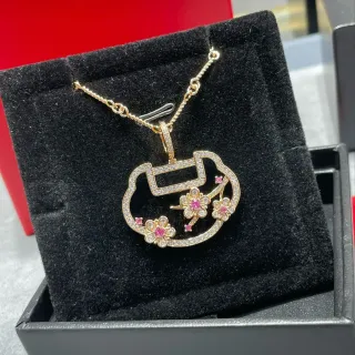 Collier pendentif en or rose ouvert pavé-set pierres transparentes