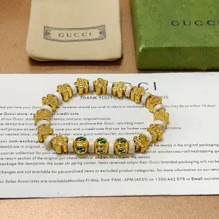 Gucci GG سوار خرز ذهبي أخضر معدني حجر أبيض