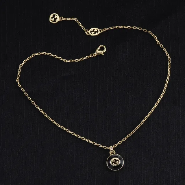 Gucci GG Marmont قلادة دائرية أسود وذهبي مينا 7