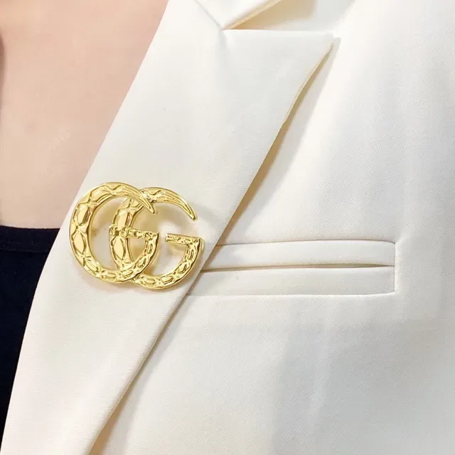 Gucci GG Marmont Quilted Gold-Tone Interlocking G Brooch 9