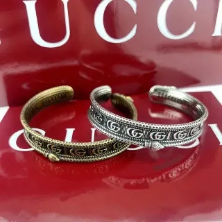 Gucci Pulsera de oro y plata con motivo interlocking G y borde de trenza