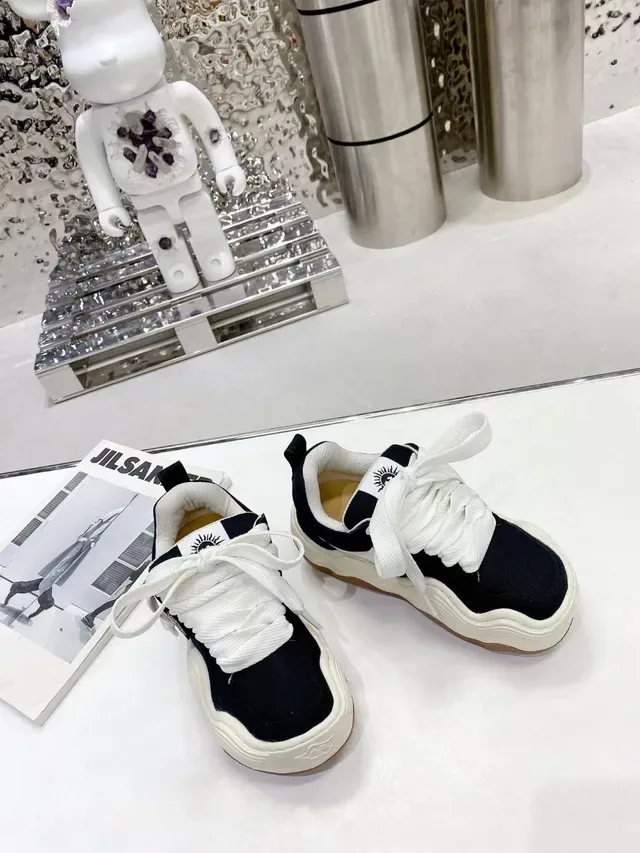 Jil Sander Sneakers Chunky Negras y Blancas con suela esculpida ondulada y parte superior de lona 6