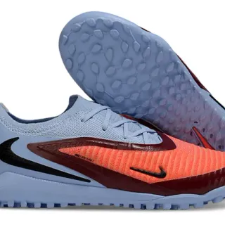 Nike Sapatos de futebol para grama sintética azul e laranja de corte baixo com upper de malha e overlay de gaiola sintético