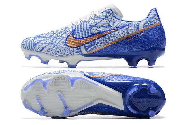 Nike Chaussures de football bleu orange à crampons moulés, tige graphique, pour terrain ferme 9