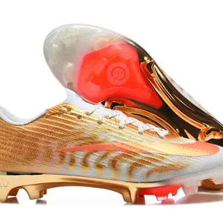 Nike Chaussures de football upper knit métallique or et orange avec accent Swoosh pour firm ground